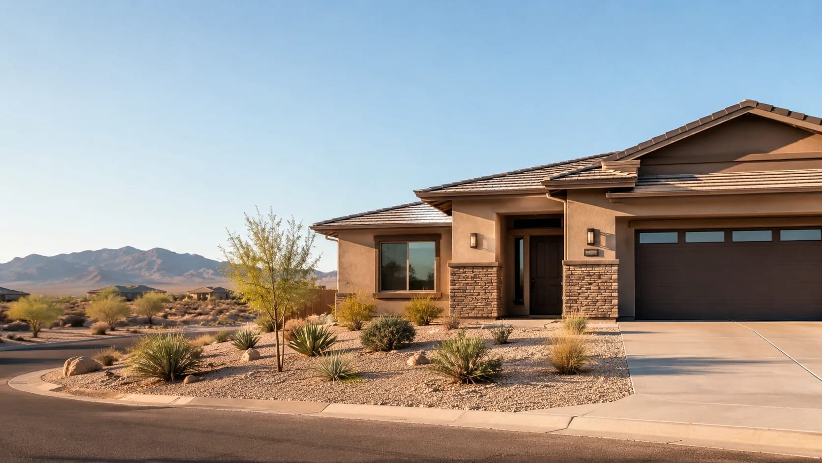 Single-story Buckeye, Arizona home with desert landscaping and mountain views