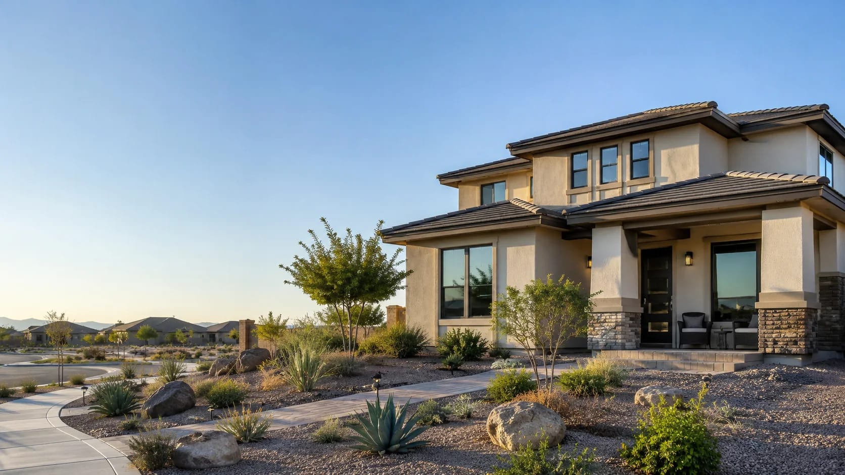 Two-story San Tan Valley, Arizona home with desert landscaping and mountain views